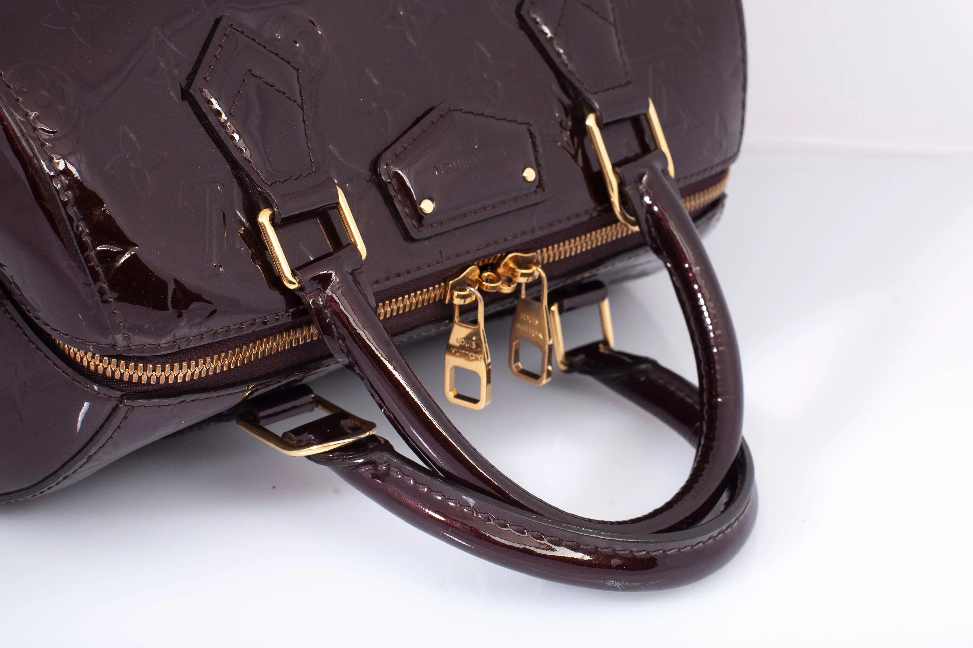 Authentic Louis Vuitton Amarante Monogram Vernis Montana Top Handle Bag