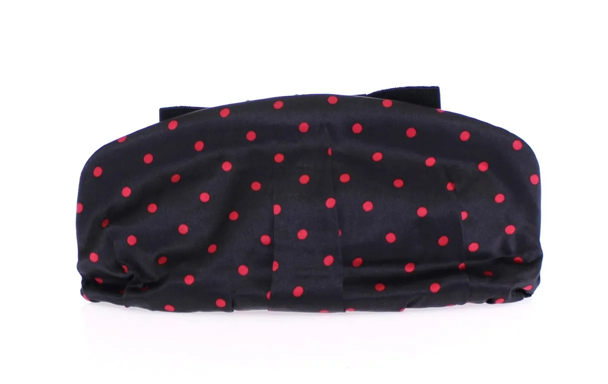 Black polka dotted silk clutch