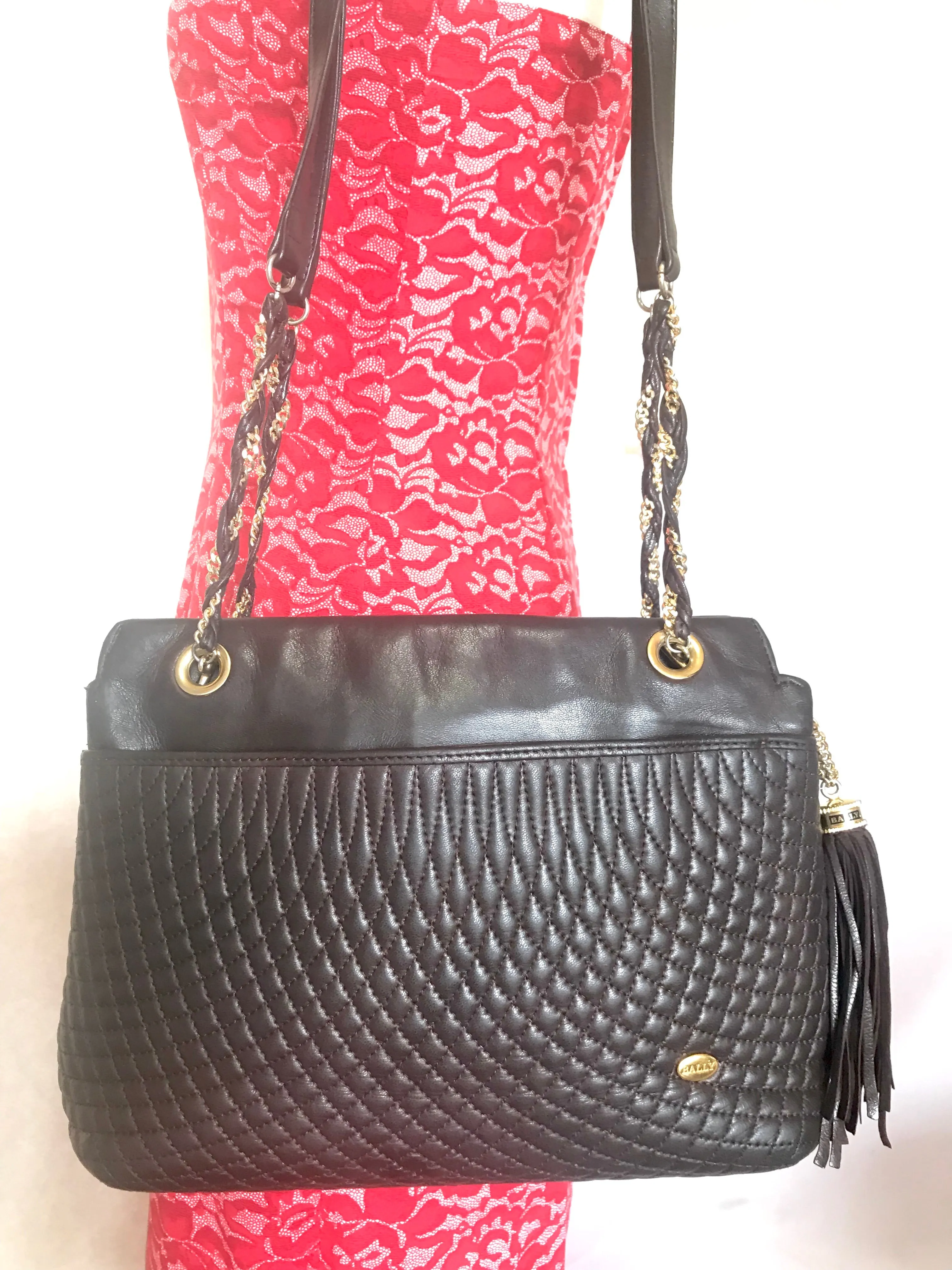 Vintage Bally quilted dark brown leather chain mix shoulder bag, tote bag with chain straps and a tassel to the zipper.