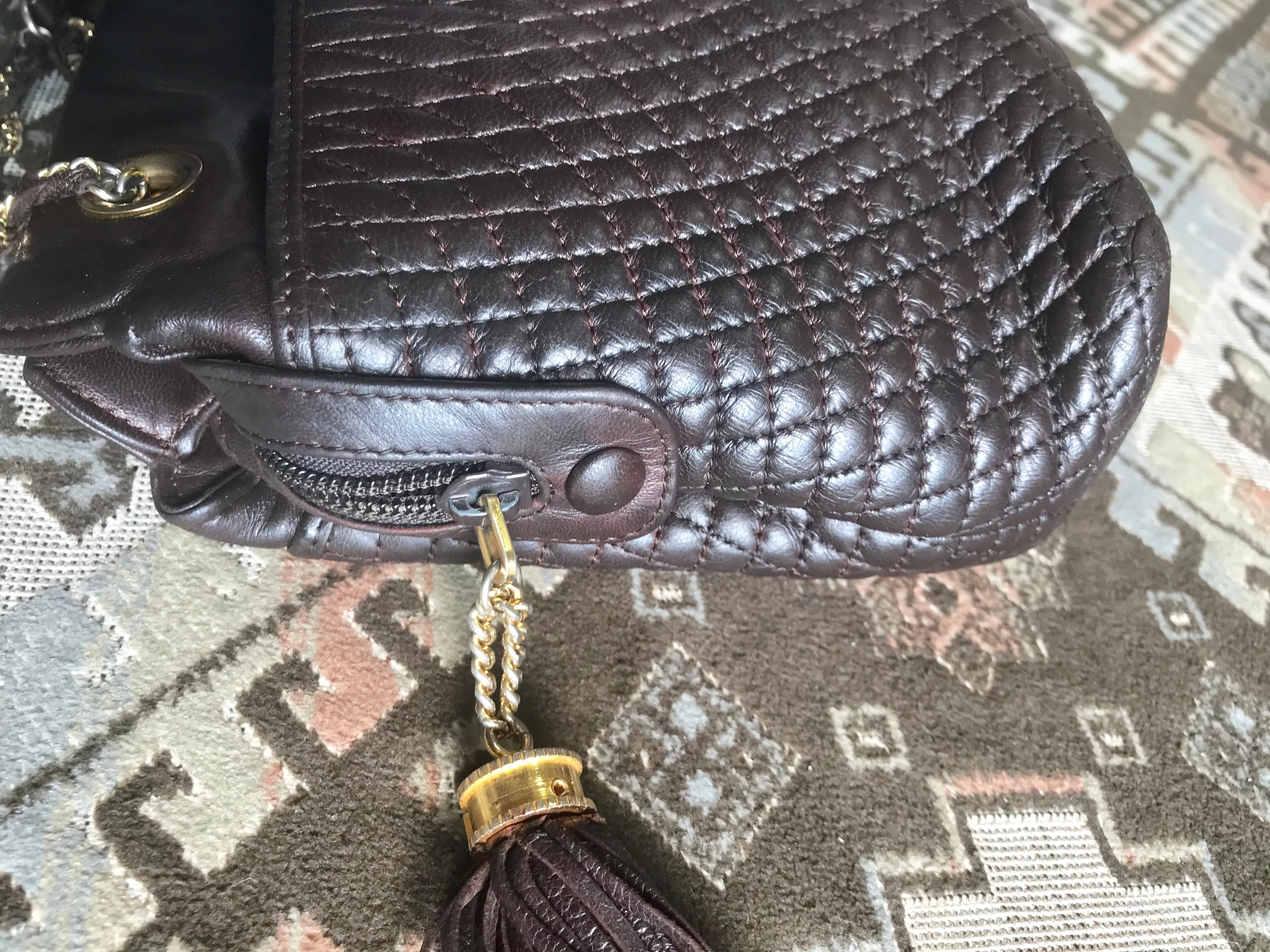 Vintage Bally quilted dark brown leather chain mix shoulder bag, tote bag with chain straps and a tassel to the zipper.