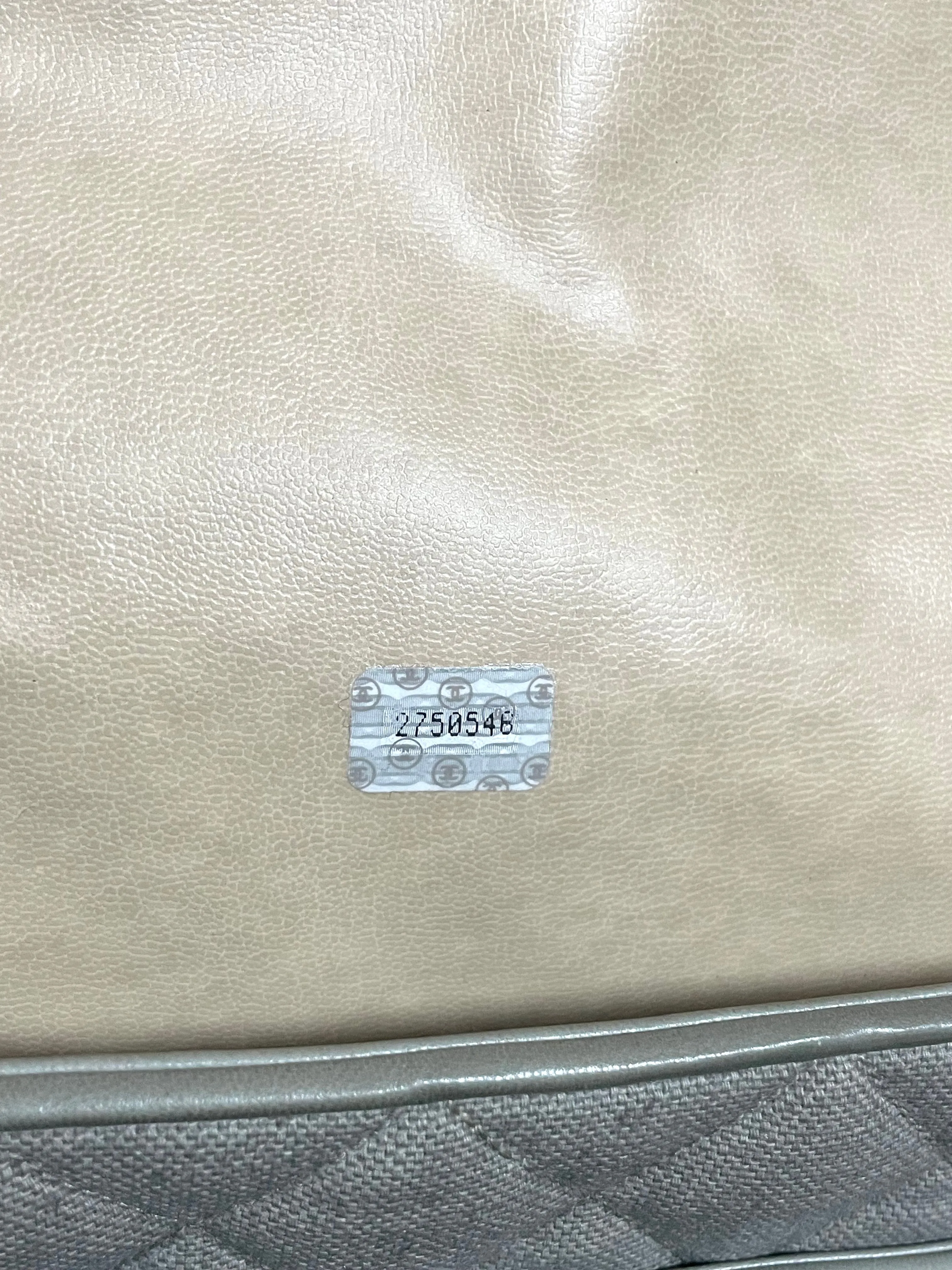 Vintage CHANEL taupe grey canvas and lambskin shoulder tote bag with gold tone chain straps and a CC ball charm. 070125ap1