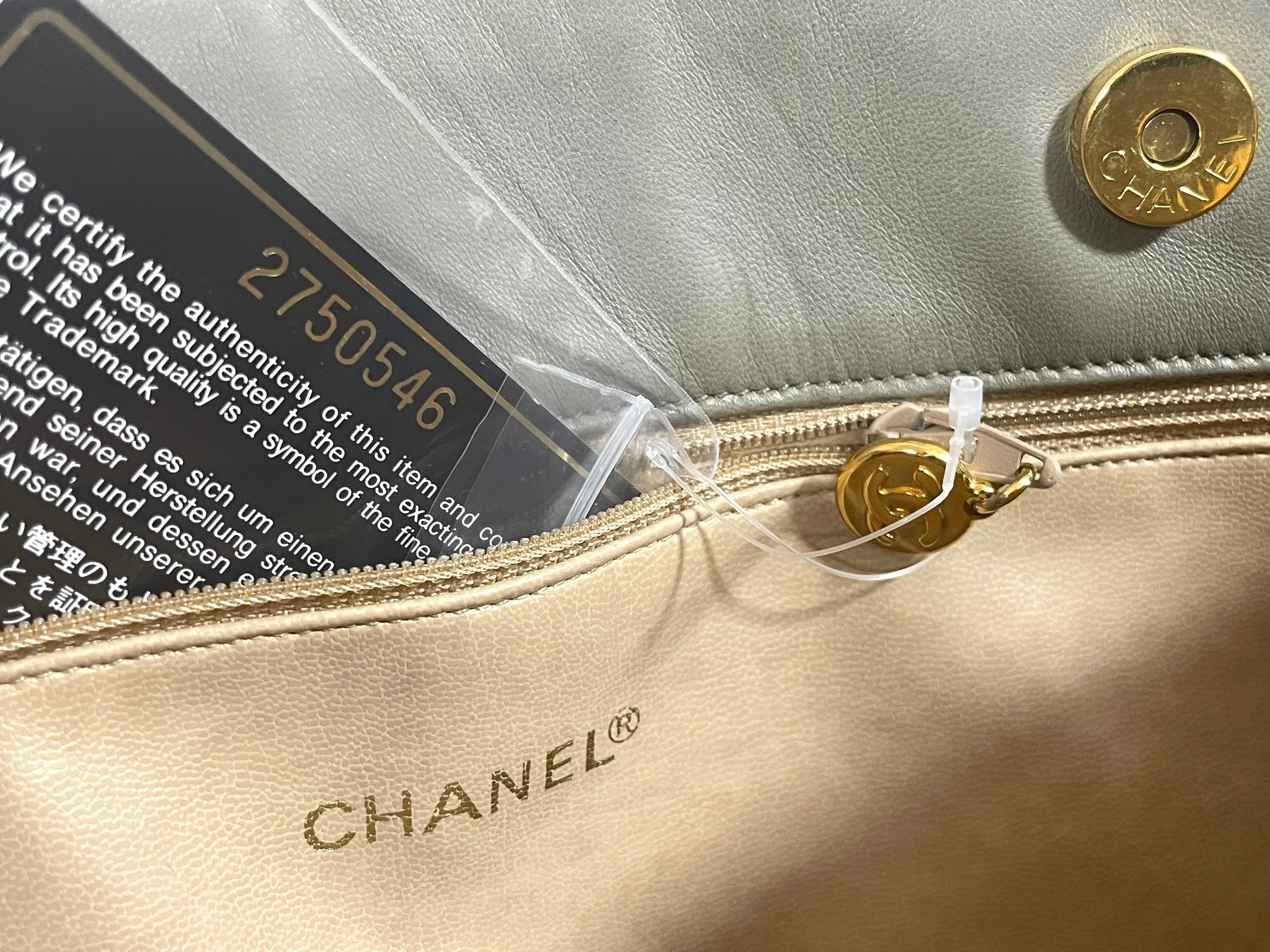 Vintage CHANEL taupe grey canvas and lambskin shoulder tote bag with gold tone chain straps and a CC ball charm. 070125ap1