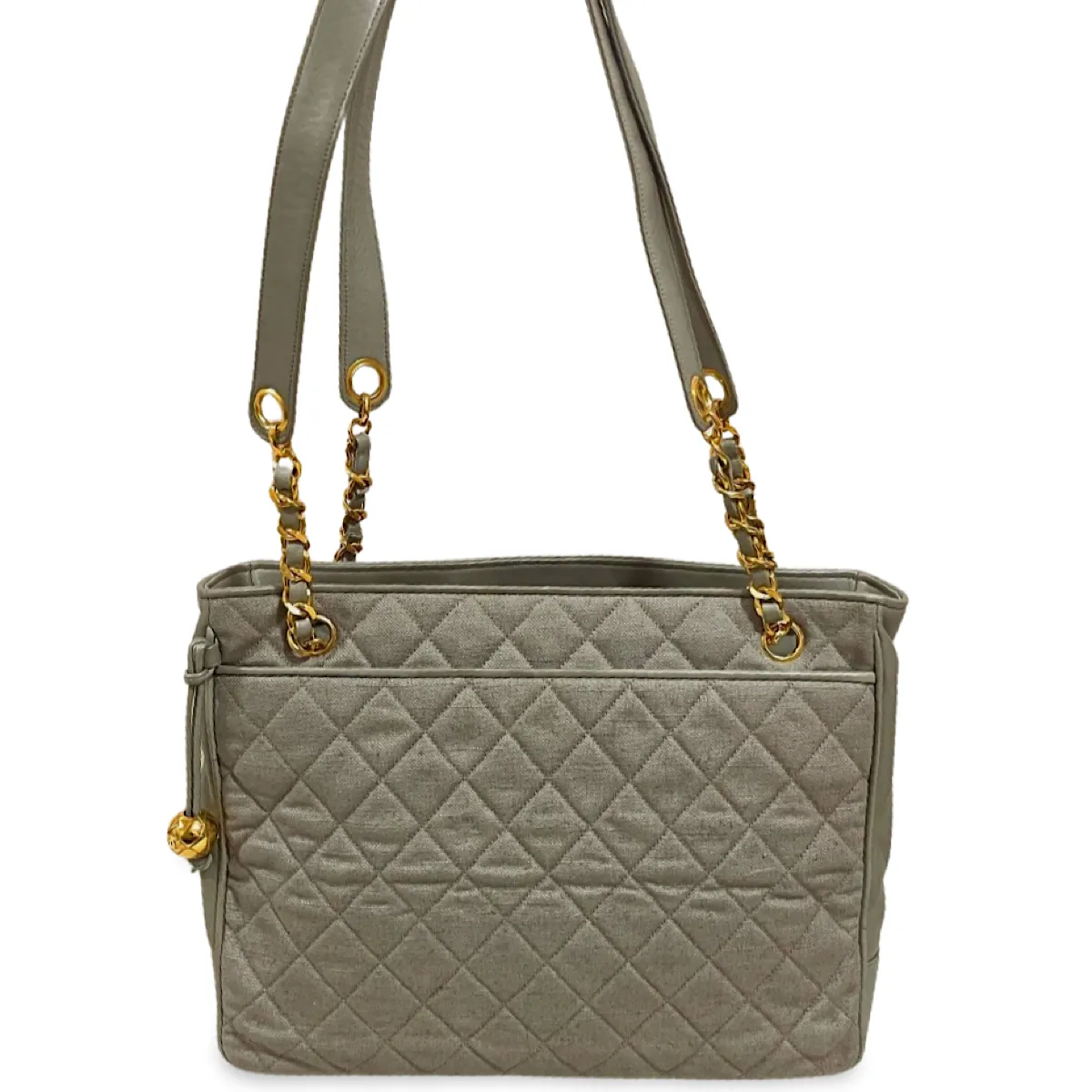 Vintage CHANEL taupe grey canvas and lambskin shoulder tote bag with gold tone chain straps and a CC ball charm. 070125ap1