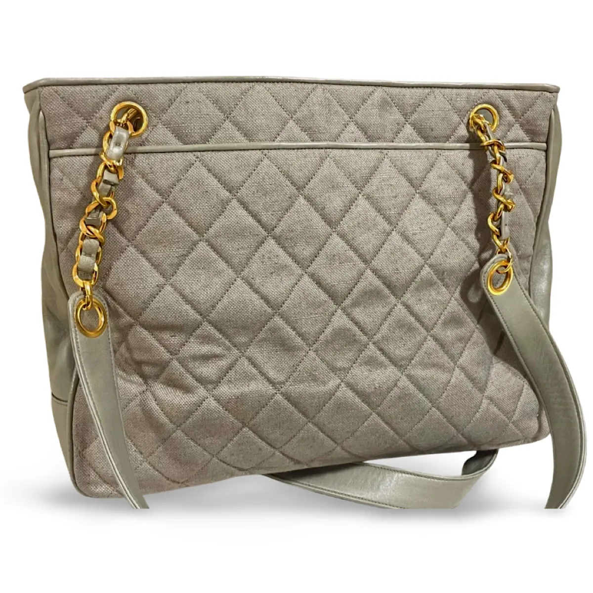 Vintage CHANEL taupe grey canvas and lambskin shoulder tote bag with gold tone chain straps and a CC ball charm. 070125ap1